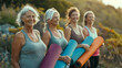 © sattawat - Happy retirement concept , group of happy retired people doing yoga session at park .