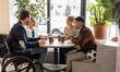 © Westend61 - Diverse business colleagues having food at lunch break in office cafe
