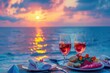 Summer love. Romantic sunset dinner on the beach. Table honeymoon set for two with luxurious food, glasses of rose wine drinks in a restaurant with sea view. Happy valentines day. 