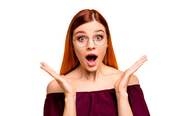 Poster - Surprised girl looks at the camera with wide open mouth and eyes isolated on yellow background