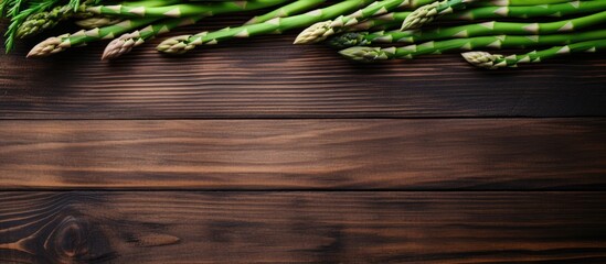 Wall Mural - Fresh Asparagus Bundle Grown Organically on Wooden Table with Copy Space for Recipes