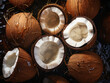Overhead view of opened fresh coconuts on dark background