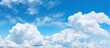 © HN Works - Vast Fluffy Cumulus Cloud Floating in a Serene Blue Sky Background