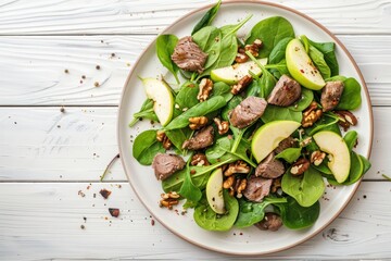 Sticker - Healthy Salad with Iron Rich Ingredients Chicken Liver, Apples, Fresh Spinach and Walnuts on White Ceramic Plate, White Wooden Background From Above Space For Text.