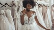 African American bride is trying on an elegant wedding dress in modern wedding salon