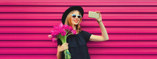 Wall Mural - beautiful happy young woman taking selfie with smartphone holding bouquet of pink rose flowers