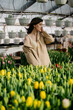 A woman in a tulip greenhouse. Growing flowers