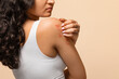 © Prostock-studio - Unhappy young woman scratching her irritated skin on arm