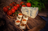 Fototapeta Miasto - Cheese rolls with various spices. Perfect as an apetizer