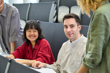 Poster - Group of multinational students having a conversation in the classroom