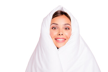 Poster - Portrait of young surprised smiling lady covered wrapped in blanket. Isolated over pink pastel background