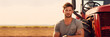 © annaspoka - agriculture student, agricultural technology education learning experience practice fieldwork mentorship youth program, young man farmer standing near red tractor machinery, banner with copy space