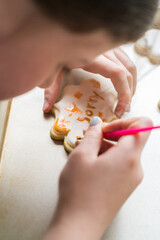 Wall Mural - Little Girl Spells 'Sorry' on Iced Sugar Cookies