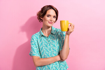 Poster - Photo of stunning peaceful person arm hold fresh aroma coffee mug enjoy free time isolated on pink color background