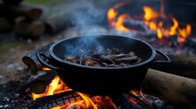 Stew Or Soup In Iron Pot Or Cauldron On A Campfire. Homemade Food At Historical Reenactment Of Slavic Or Vikings Lifestyle From Around 11th Century, Cedynia, Poland.


