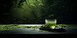 A glass teapot with green liquid pouring transparent on beautiful cup dark wooden table  filled with green tea  green wall