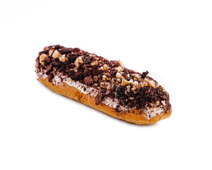 Wall Mural - eclair with chocolate and nuts on a white