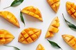 a group of cut mangoes with leaves