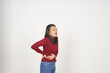 © Sino Images Studio - Young Asian woman in Red t-shirt Suffering stomachache, pain on stomach isolated on white background