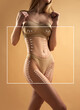 © Lustre Art Group  - Cropped portrait of young, slim female body in sandy color lingerie with white arrows against beige studio background. Concept of beauty procedures, cosmetology treatment, massage. Ad