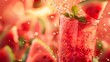 © Mickey - Splashing Watermelon Cocktail with Mint - Attractive image of a fresh watermelon cocktail with mint, with water splashing around the glass