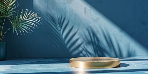 Wall Mural - A round golden podium on an abstract blue background with a shadow of palm leaves.