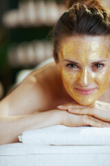 Poster - relaxed modern woman in spa salon laying on massage table