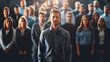 A diverse group of business professionals, likely colleagues, standing in a line at the officeใ