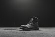 hard work on Labor Day by photographing a solitary work boot against a stark, monochromatic background.