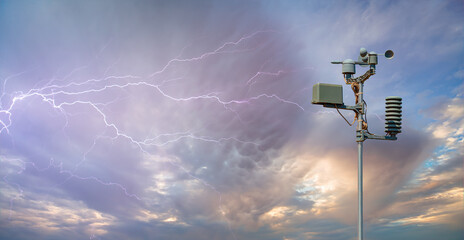 Wall Mural - weather station automatic measurement of weather parameters with stormy sky and rain and lightning