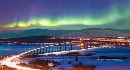 Wall Mural - aurora borealis or northern lights in the sky over tromso with sandnessundet bridge - tromso, norway