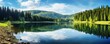 Stunning panorama background from the Mummelsee in the Black Forest on the Black Forest High Road, with reflection in the water