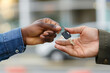 © Raul_Brm - two colored hands exchanging keys.