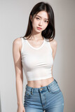 Fototapeta Sport - Gorgeous Young Female Model - Fashion or Cosmetics Model - White Top and Blue Jeans - Flawless Skin and Fine features - Beautiful Smooth Hair