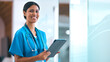 © Monkey Business - Portrait Of Female Doctor Or Nurse With Digital Tablet Checking Patient Notes In Hospital