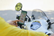 © DragonImages - Motorbike taxi driver accepting new request via mobile application