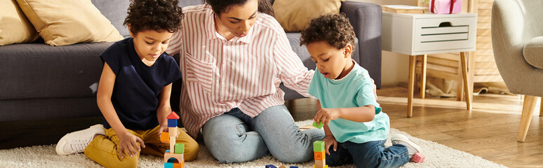 beautiful african american woman in homewear playing with her adorable children at home, banner