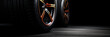 Sleek Performance Tires with Orange Accents on a Black Background