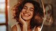 © Ellionn - Beautiful woman look at mirror and smiling yourself. Self love concept. Home morning routine. Pretty girl without make up. No makeup female face. Happy person bathroom. Feminine reflection. Skin care.