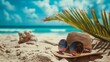 A hat and sunglasses lie on the sandy sea beach. Vacation, travel and recreation.