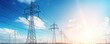 Electricity background - Voltage power lines / high voltage electric transmission tower with blue sky and shining sun