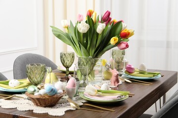 Wall Mural - Festive table setting with beautiful flowers. Easter celebration