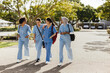 © Jacob Lund - Medical school: Female health students walk to their next class at university