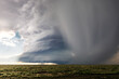 Supercell storm clouds over a field
