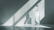 A sleek bottle of Absolut vodka stands tall, its iconic clear design catching the light against a minimalist backdrop.