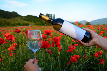 Canvas Print - Bottle of wine in a flower field