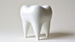 © Olga - a white tooth sculpture sitting on top of a white table next to a white wall and a white wall behind it.