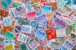 © bukhta79 - Ukraine, Kiyiv - January 12, 2023 Netherlands Postage stamps..Postage stamps.A collection of world stamps in a pile.Postage stamps from different countries and times