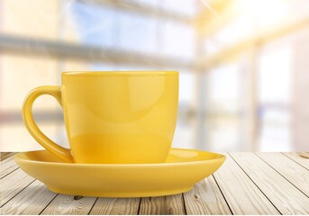 Wall Mural - huge ceramic yellow mug on the desk