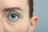 Fototapeta  - Vision test. Woman and digital scheme focused on her eye against grey background, closeup